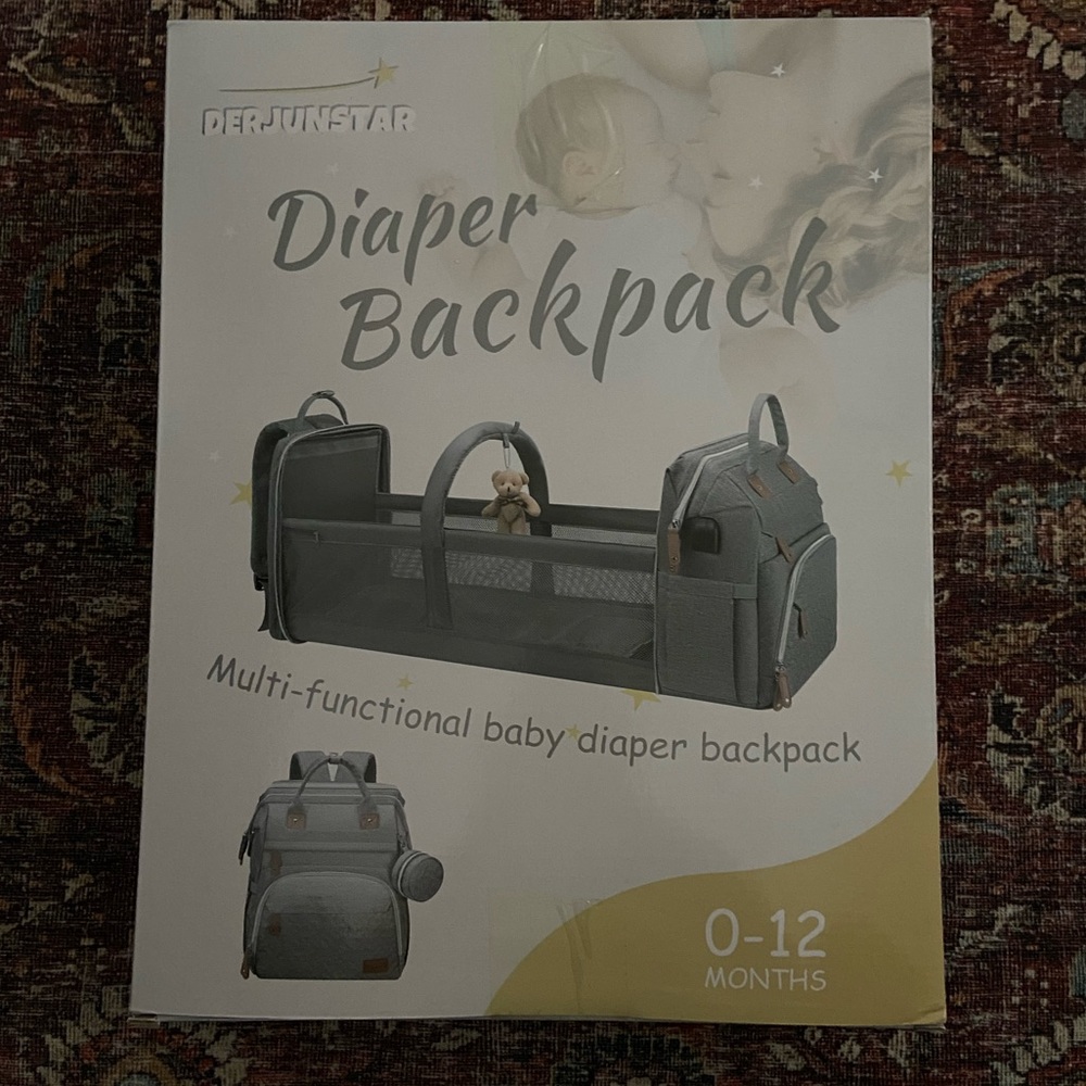 Diaper bag backpack with changing station